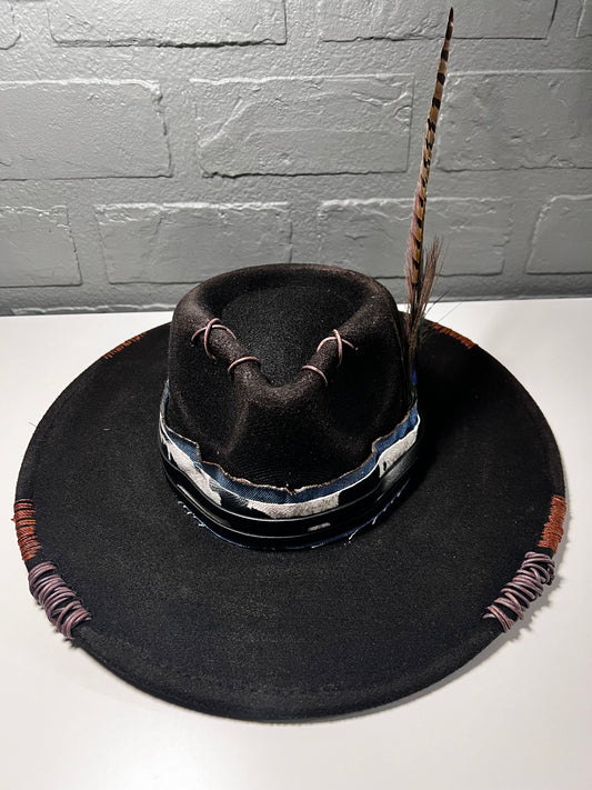 Black cowboy hat with cow print